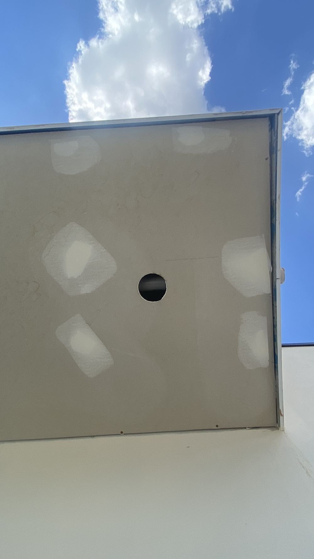 A balcony with nowhere for the water to go