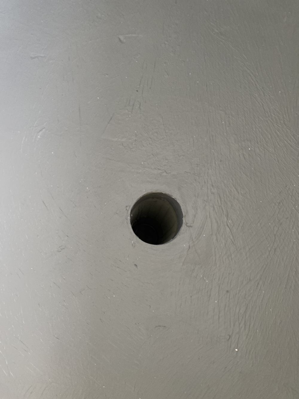 Floor waste fitted without a puddle flange bonded into the membrane, found during a waterproofing inspection in Blacktown
