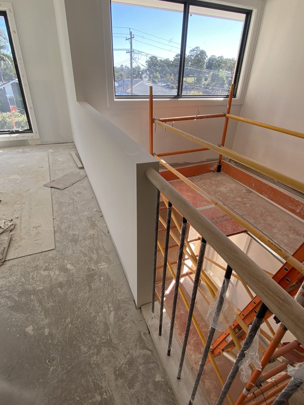 Stair balustrade loose and unsecured, needing fixing before painting, found during a fixing stage inspection in Kellyville
