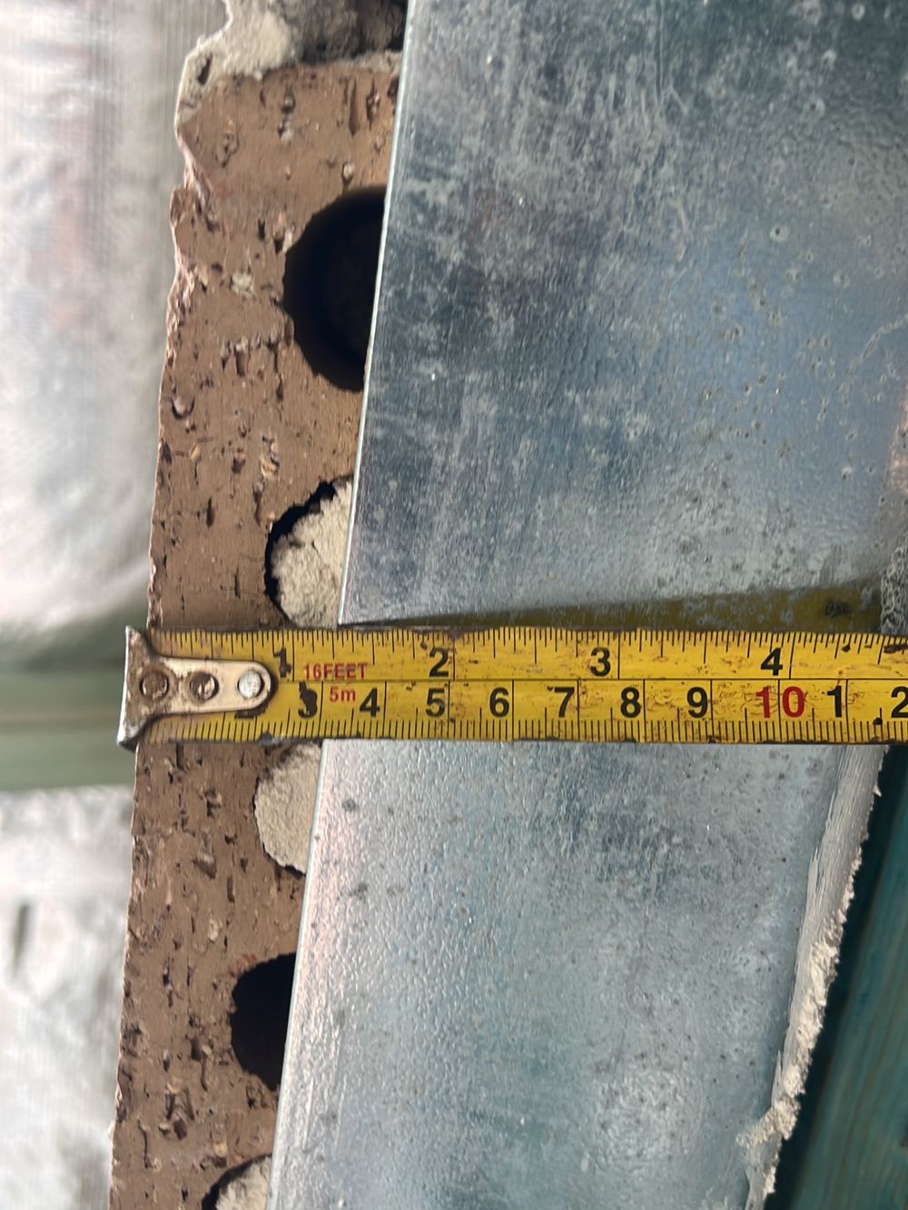 Bricks overhanging their steel lintel by 30mm, beyond the 25mm limit, found during a lock-up inspection in Kellyville