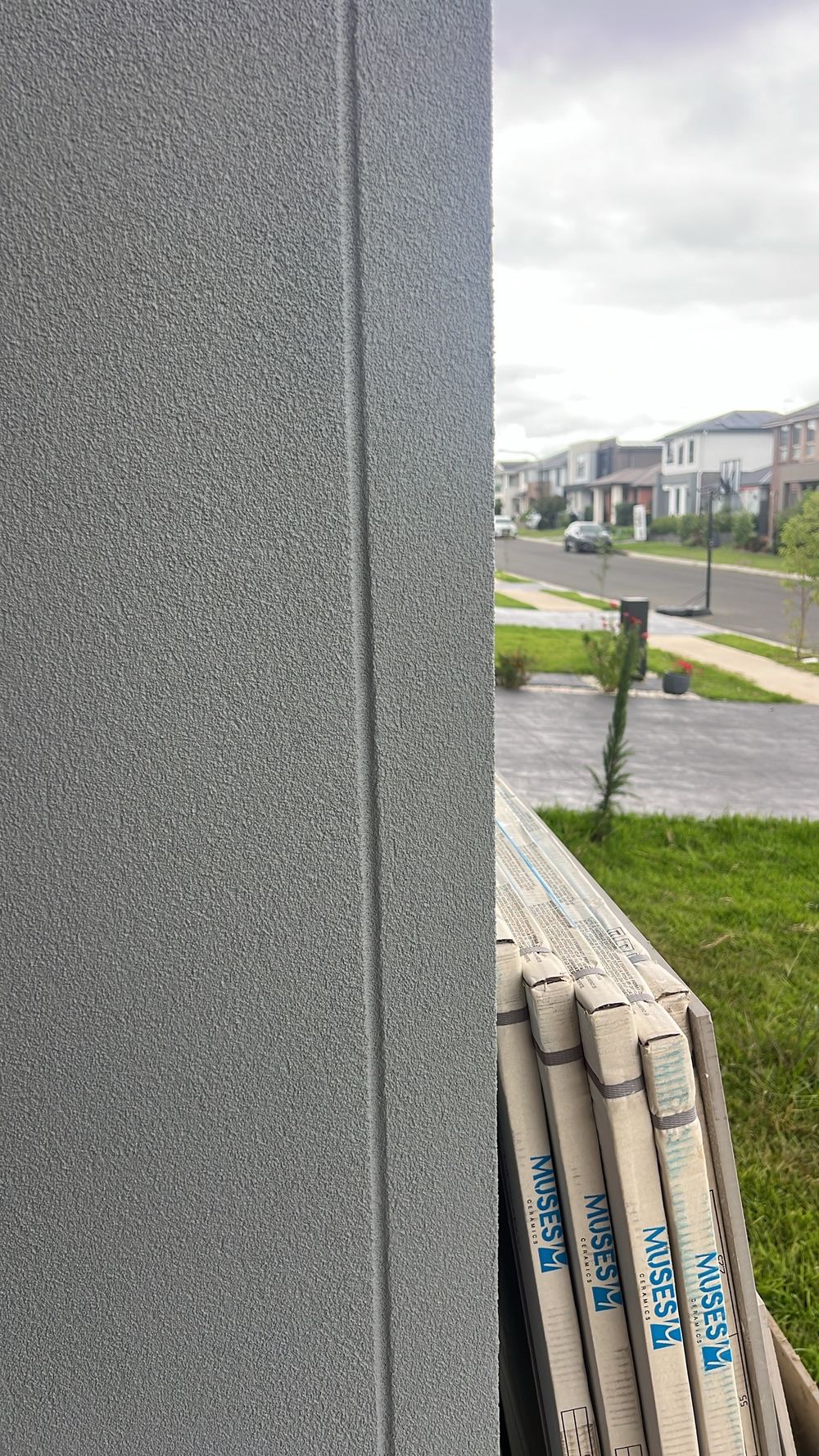 Render covering a control joint, so the wall cannot move where it was designed to, found during a handover inspection in Tallawong