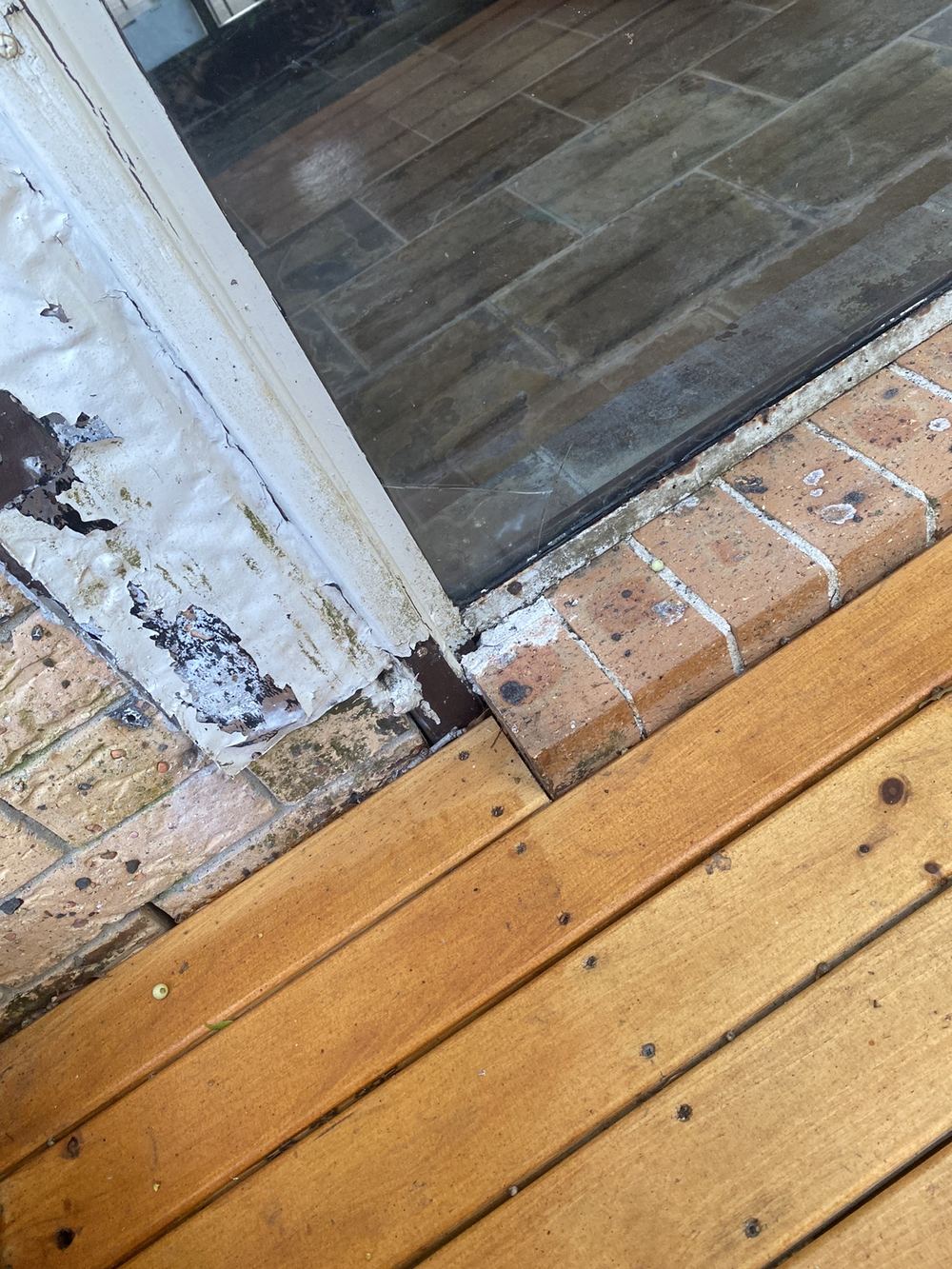 Staining and decay around rear openings from poor weatherproofing, found during a pre-purchase inspection in St Ives