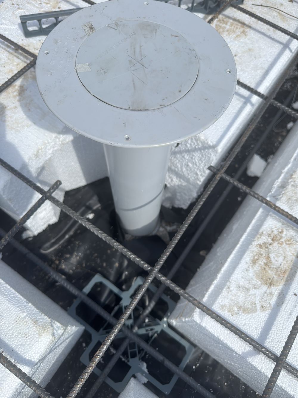 Vapour barrier laps left untaped, giving ground moisture a path into the slab, found during a slab inspection in Tallawong